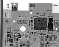 Top-left of upper side of the circuit board