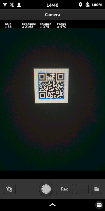 QR code detected in the camera application, showing blue box outline and link overlay