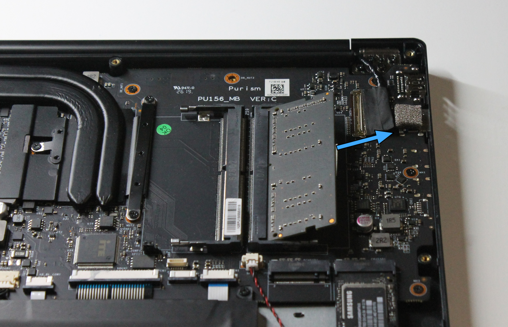 DIMM released in socket, with removal direction marked