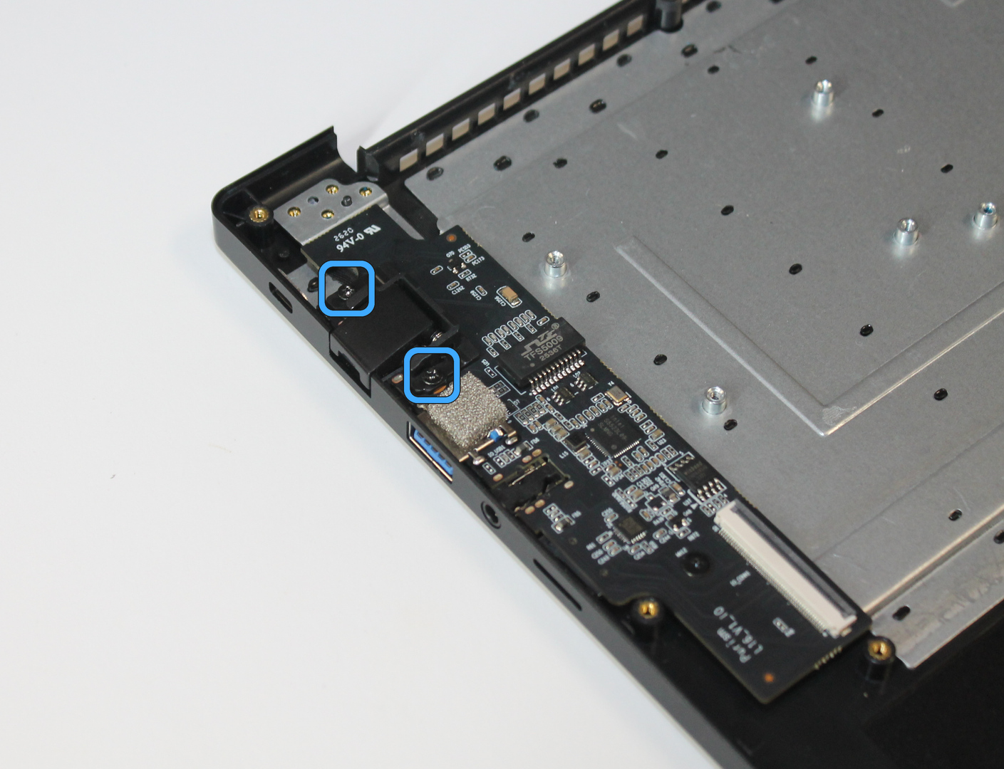 Ethernet cover, with screw locations marked