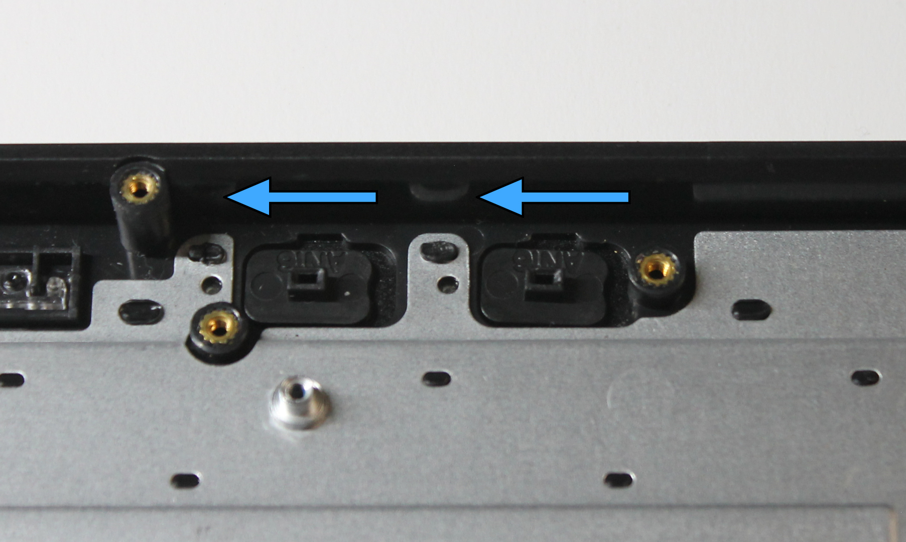 Kill switch caps in position to align with mainboard, slide direction indicated