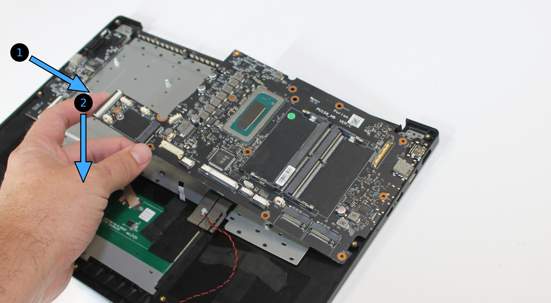 Mainboard inserted into chassis edge, with insert directions indicated