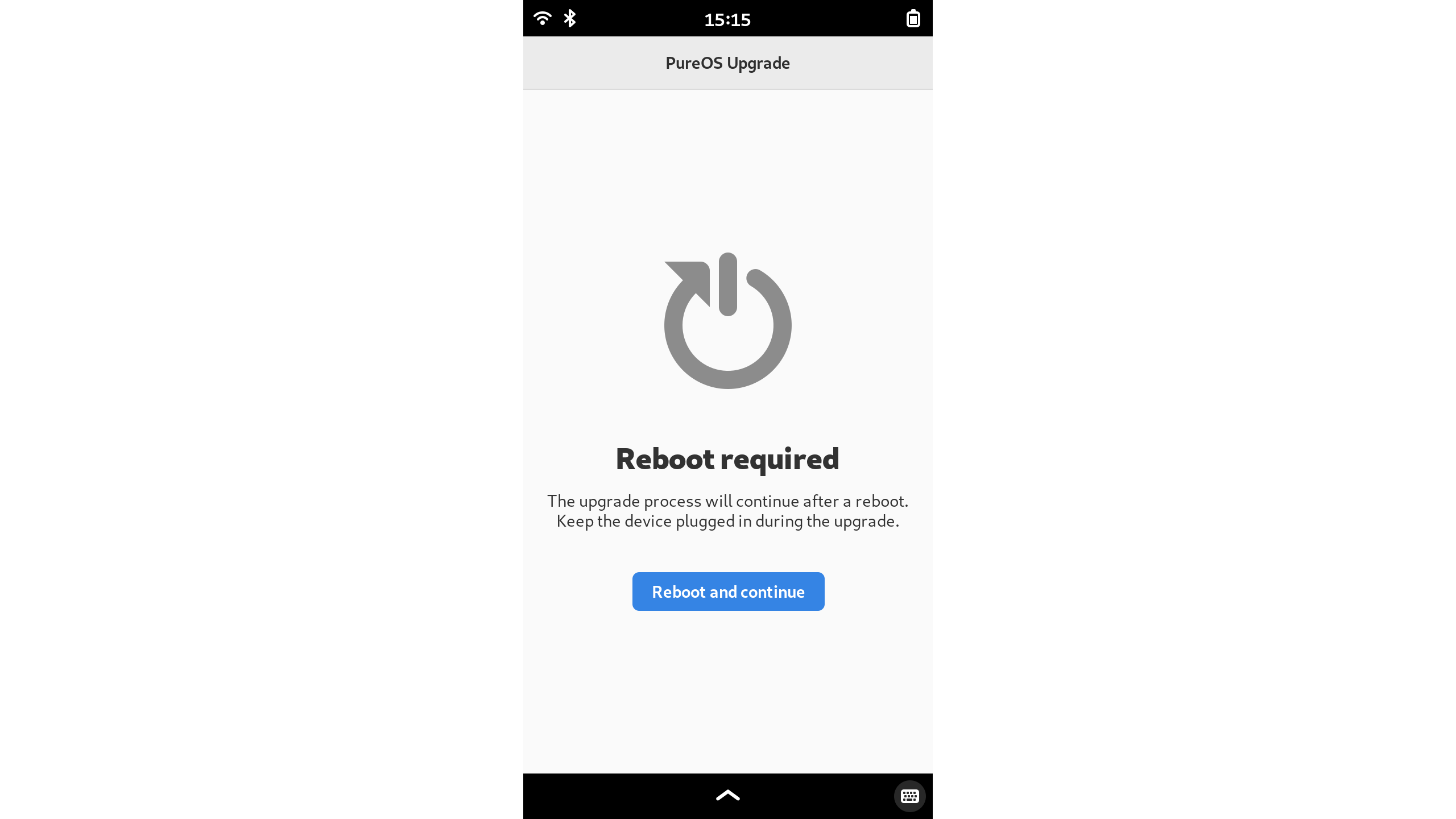 Screenshot of the PureOS Upgrade application asking to restart the device to complete the upgrade.