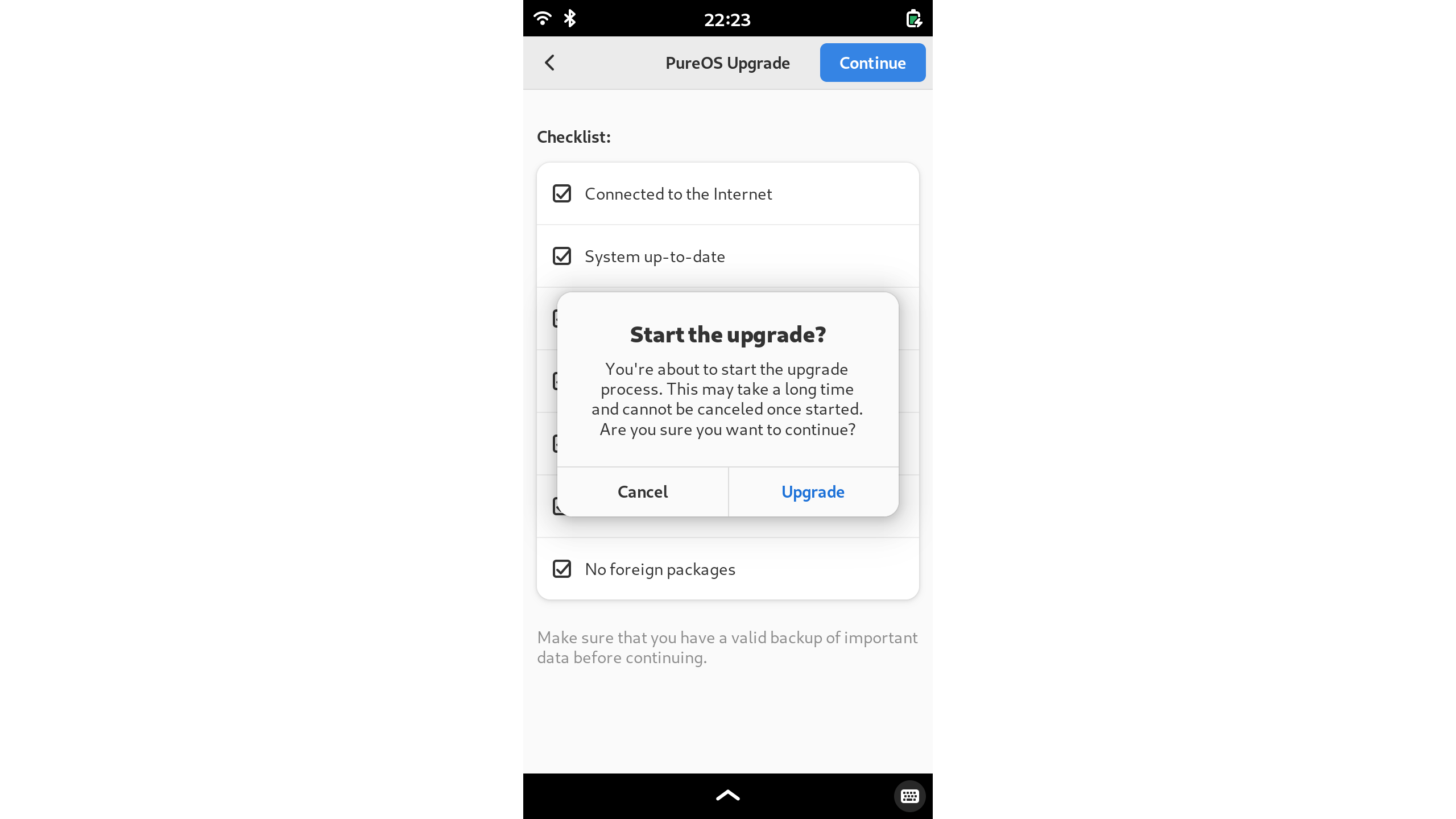 Screenshot of the PureOS Upgrade application warning the user about the potential of a long upgrade time.